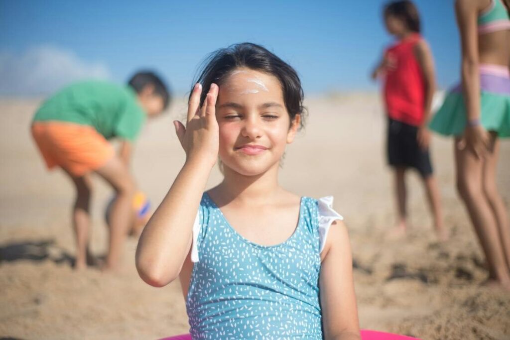 A girl wearing sunscreen