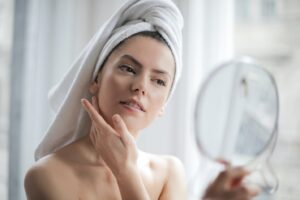 Woman Applying Premium Skincare Products