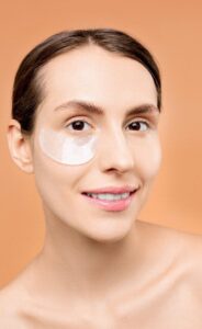 Woman Applying Premium Skincare Products