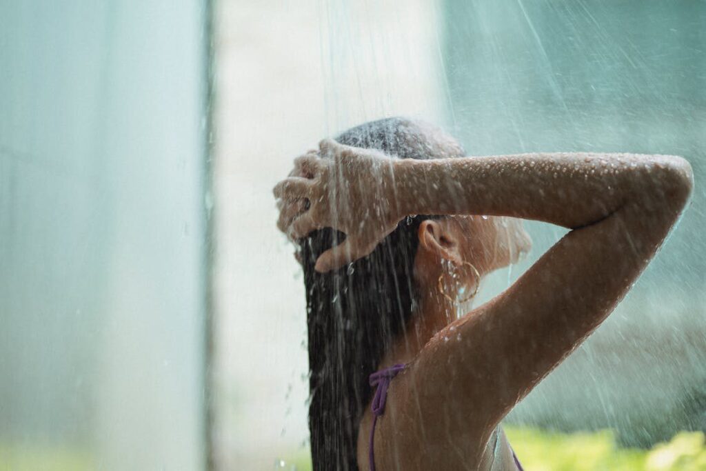 A Woman Takes a Quick Shower for Sustainable Scalp Care