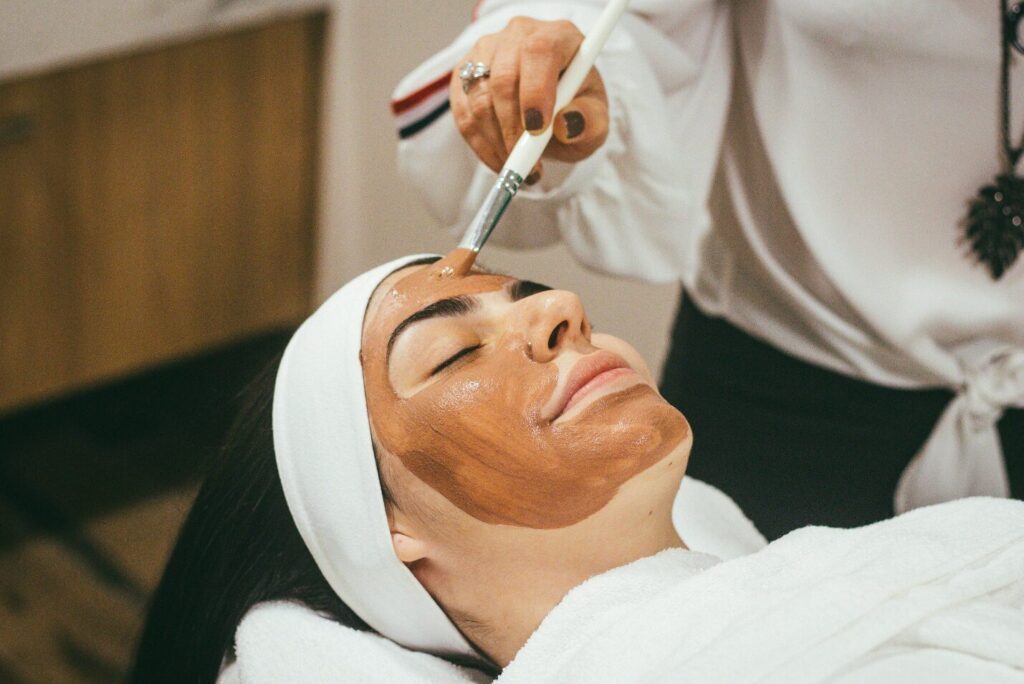 A woman getting a relaxing facemask